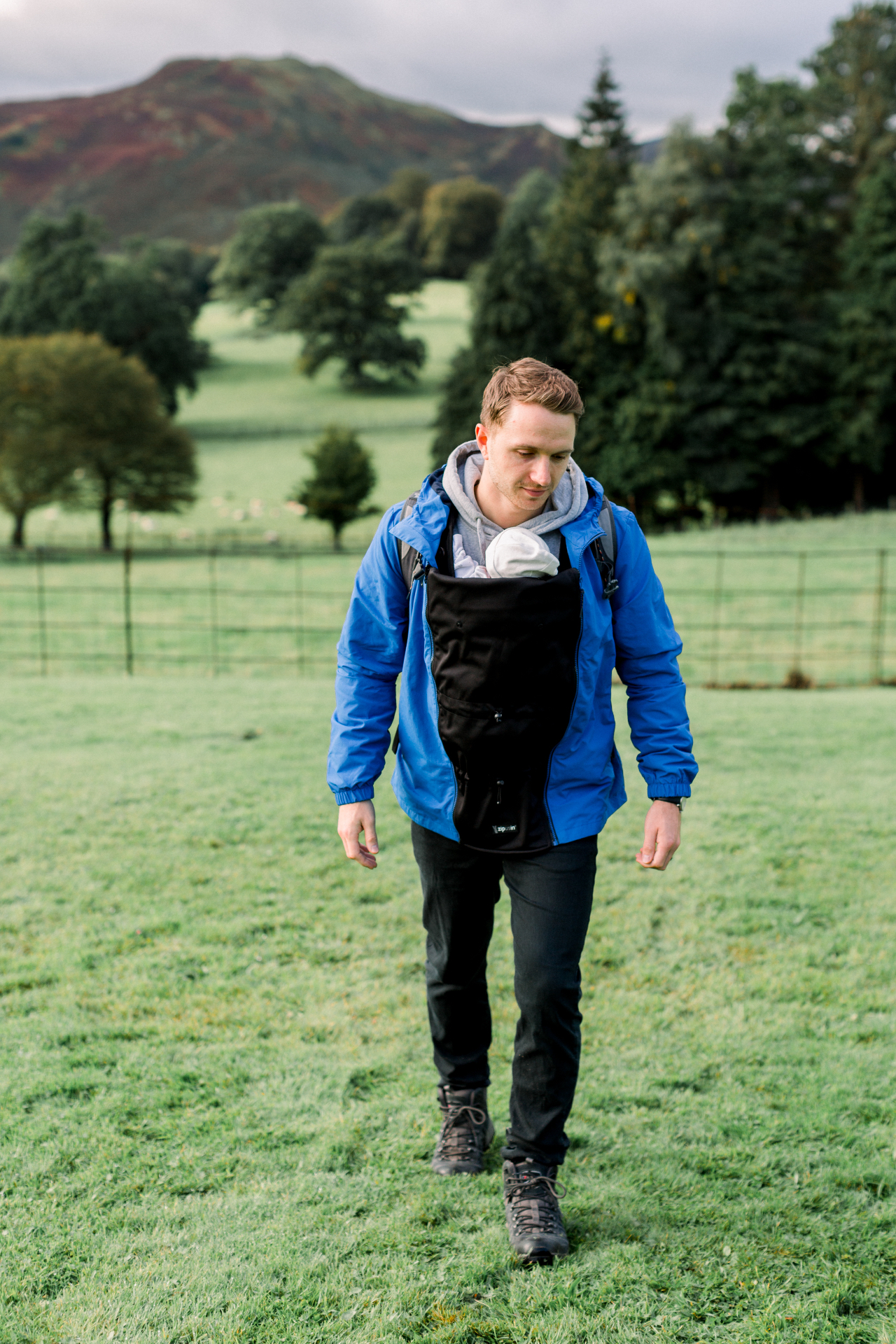 Babywearing panel in blue jacket